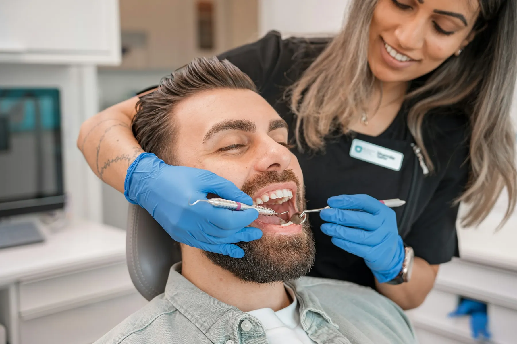 A professional dental cleaning in progress